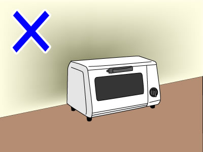 壁や家具の近くで使用しない